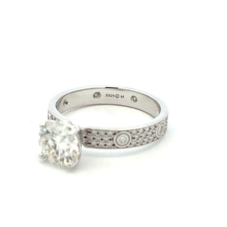 Round solitaire with bezel-accent pavé band moissanite ring in sterling silver