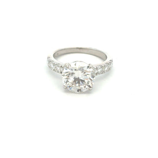 Round solitaire with channel-set round accents moissanite ring in sterling silver, view 2