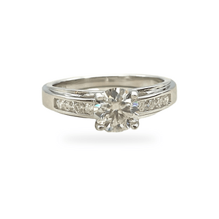 Round solitaire with channel-set square shoulders moissanite ring in sterling silver