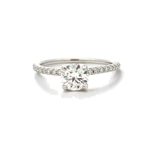 Round solitaire with pavé shoulders on thin band moissanite ring in sterling silver