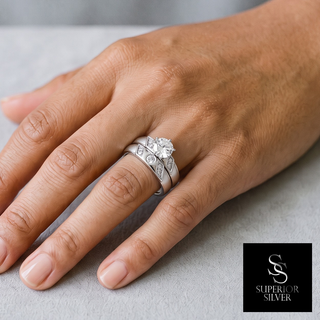 Round Solitaire with Slash Accents Bridal Set Moissanite Ring in sterling silver, worn on hand