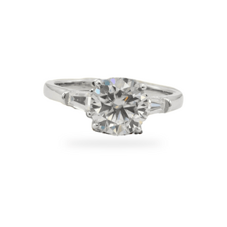 Round solitaire with small prong-set side stones moissanite ring in sterling silver