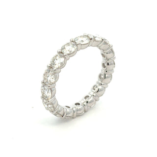 Shared-Prong large round eternity band moissanite ring in sterling silver