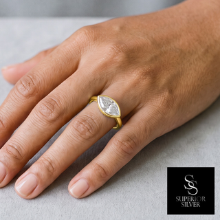 Sideways Marquise Bezel Polished Band Moissanite Ring in yellow gold vermeil over sterling silver, worn on hand