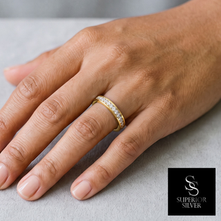 Single-Row Channel Pavé Band Moissanite Ring in yellow gold vermeil over sterling silver, worn on hand