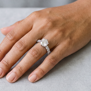 Six-Prong Round with Large Stone-Set Band Moissanite Ring in sterling silver, worn on hand