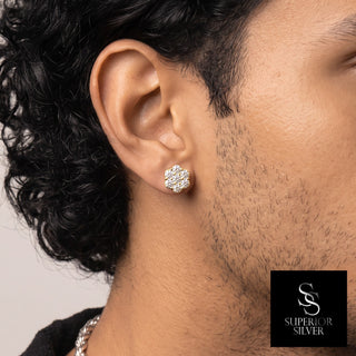 Small seven-stone flower cluster moissanite stud earrings in yellow gold vermeil over sterling silver, worn on model