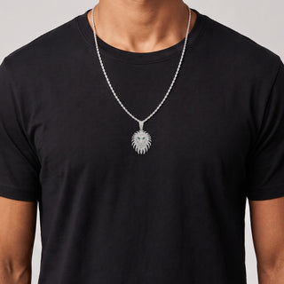 Spiked-Mane Lion Head with Green Eyes Moissanite Pendant in sterling silver, worn on model