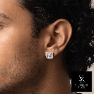Square halo cluster center moissanite stud earrings in sterling silver, worn on model