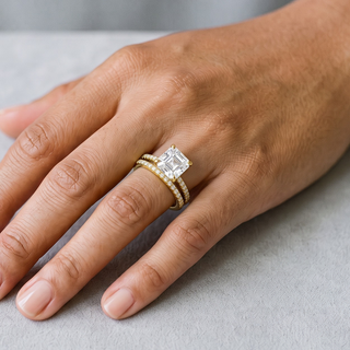 Square Step-Cut Solitaire Bridal Set Moissanite Ring in yellow gold over sterling silver, worn on hand