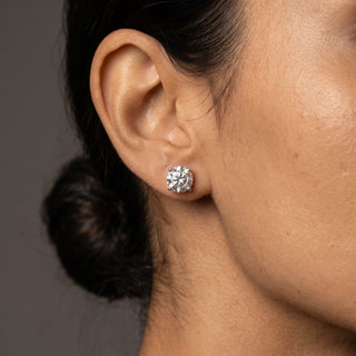 Sterling silver 8mm round moissanite solitaire stud earrings shown on model