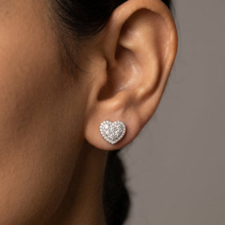 Sterling silver pave cluster heart halo moissanite stud earrings shown on model