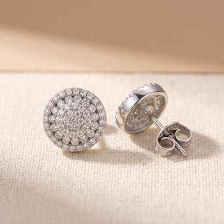 Close-up of the sterling silver pavé disc stud showing the concentric rings on a flat face