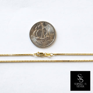 Superior Silver 10K yellow gold diamond-cut box link chain with spring ring clasp next to a US quarter for scale.