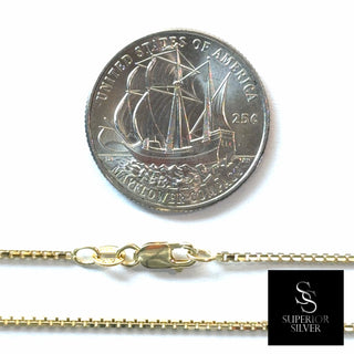 Superior Silver 10K yellow gold diamond-cut box link chain with spring ring clasp next to a US quarter coin