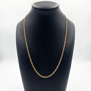Superior Silver 20-inch 3.0mm curb link chain necklace crafted in polished 10K yellow gold on a black display bust.