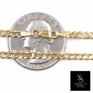 Superior Silver 10K yellow gold curb link chain with a lobster clasp, shown against a US quarter for scale.