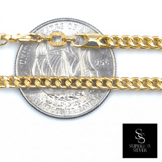Superior Silver 10K yellow gold 2.0mm Franco link chain with a lobster clasp, shown against a US quarter for scale.