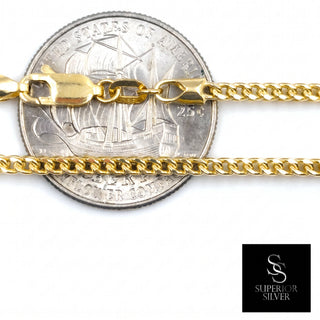 Superior Silver 2.2mm 10K yellow gold Franco link chain with a lobster clasp shown against a US quarter for scale.