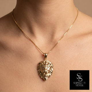Superior Silver 10K yellow gold lion head pendant with diamond-cut detailing worn on a gold chain
