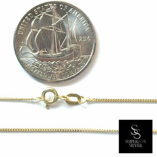 Superior Silver 10K yellow gold micro curb link chain with spring ring clasp shown next to a US quarter for scale