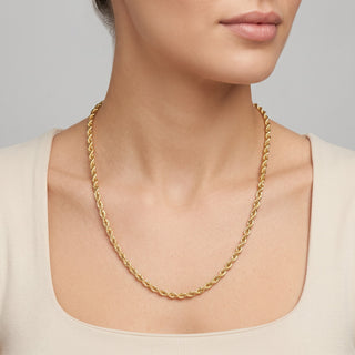 Superior Silver 10K yellow gold 4.2mm rope chain necklace worn on a model, featuring a polished twisted link design.