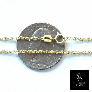 Superior Silver 10K yellow gold Singapore link chain with spring ring clasp, shown next to a US quarter for scale.