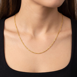 Superior Silver 10K yellow gold Singapore link chain worn on a neck, featuring a 1.7mm twisted design.