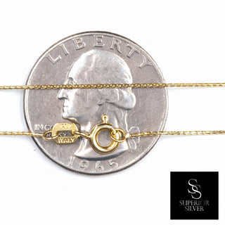 Superior Silver 20-inch 10K yellow gold wheat chain with a spring ring clasp resting on a US quarter for scale.