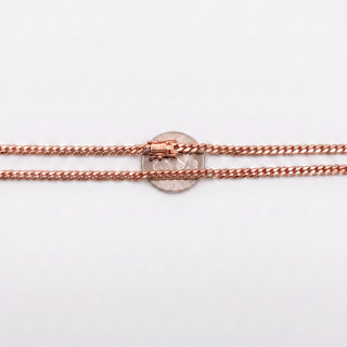Superior Silver 10K rose gold 3.9mm Miami Cuban link chain with a secure box clasp, shown against a US quarter coin.