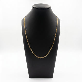 Superior Silver 22-inch curb link chain in 10K yellow gold displayed on a black mannequin bust