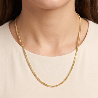 Superior Silver 20-inch 2.2mm Franco link chain in solid 10K yellow gold with a polished finish worn on a model