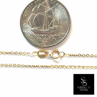 Superior Silver 22-inch 10K yellow gold cable link chain with spring ring clasp shown next to a US quarter coin