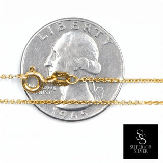 Superior Silver 20-inch 10K yellow gold link chain with spring ring clasp shown against a US quarter for scale