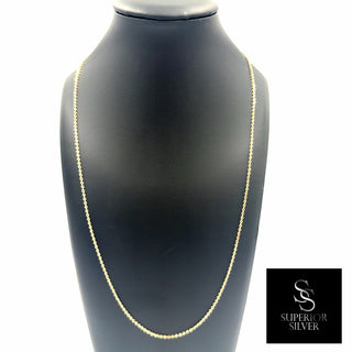Superior Silver 24-inch 1.6mm solid 10K yellow gold flat cable link chain displayed on a black jewelry bust