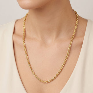 Superior Silver 10K yellow gold 4.3mm rope link chain necklace worn around the neck with a polished finish