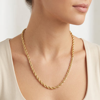 Superior Silver 10K yellow gold 5.3mm rope link chain worn on a model, featuring a polished twisted spiral design.