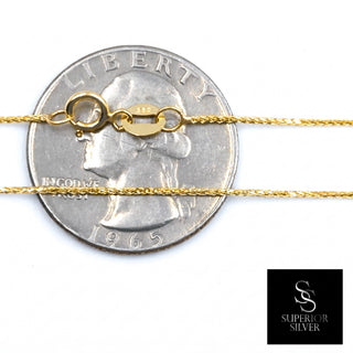 Superior Silver 18-inch 10K yellow gold wheat chain with a spring ring clasp shown against a US quarter for scale.