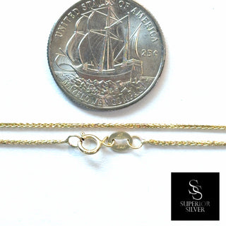 Superior Silver 18-inch 10K yellow gold wheat chain with a spring ring clasp, shown next to a US quarter for scale.