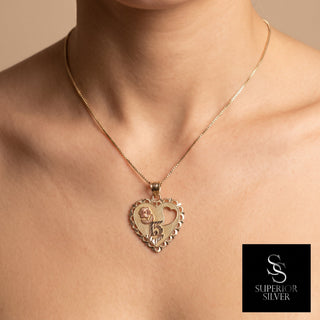 Superior Silver 14K yellow gold heart-shaped Quinceanera 15 Anos pendant with diamond-cut detailing worn on a chain.