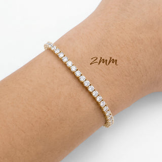 Superior Silver 2mm round brilliant moissanite tennis bracelet in gold vermeil on a wrist