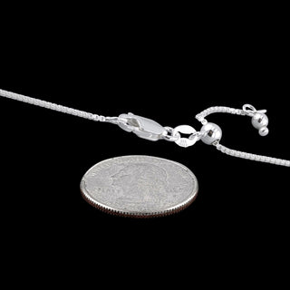 Superior Silver 0.8mm diamond-cut adjustable sterling silver box chain with lobster clasp shown next to a US quarter.