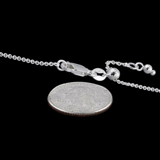 Superior Silver 1.4mm adjustable sterling silver cable chain with lobster clasp shown next to a US quarter for scale.