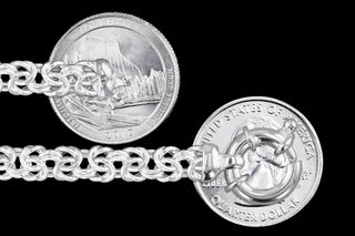 Superior Silver 6.5mm sterling silver Byzantine chain with lobster clasp shown next to US quarters for scale