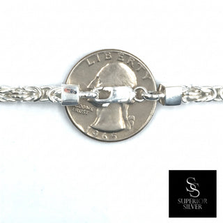 Superior Silver 4.4mm Byzantine link chain in polished 925 sterling silver with a lobster clasp, shown next to a coin.