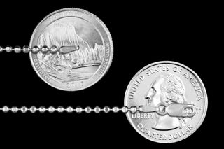Superior Silver 2.2mm diamond-cut bead chain in 925 sterling silver with a lobster clasp, shown next to US quarters.