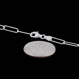 Superior Silver 4mm diamond-cut paper clip chain in 925 sterling silver with a pear clasp next to a US quarter coin.