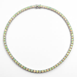 Superior Silver round cut Ethiopian opal tennis chain in 925 sterling silver with green and orange fire flashes.