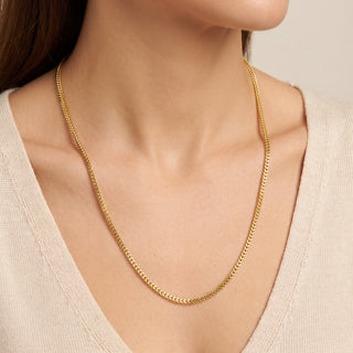 Superior Silver 26-inch flat Franco chain necklace in 14kt yellow gold over 925 sterling silver worn on a model