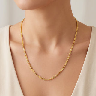 Superior Silver 20-inch flat Franco chain necklace in 14kt yellow gold over 925 sterling silver worn on a model